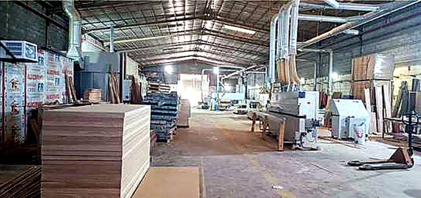 Carpentry workshop production area with boards, panels and fabrication equipment
